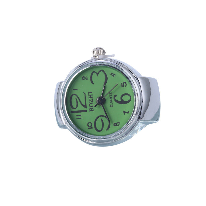 Anillo reloj plateado con forma de flor y números grandes, elegante y único, ideal para estudiantes.